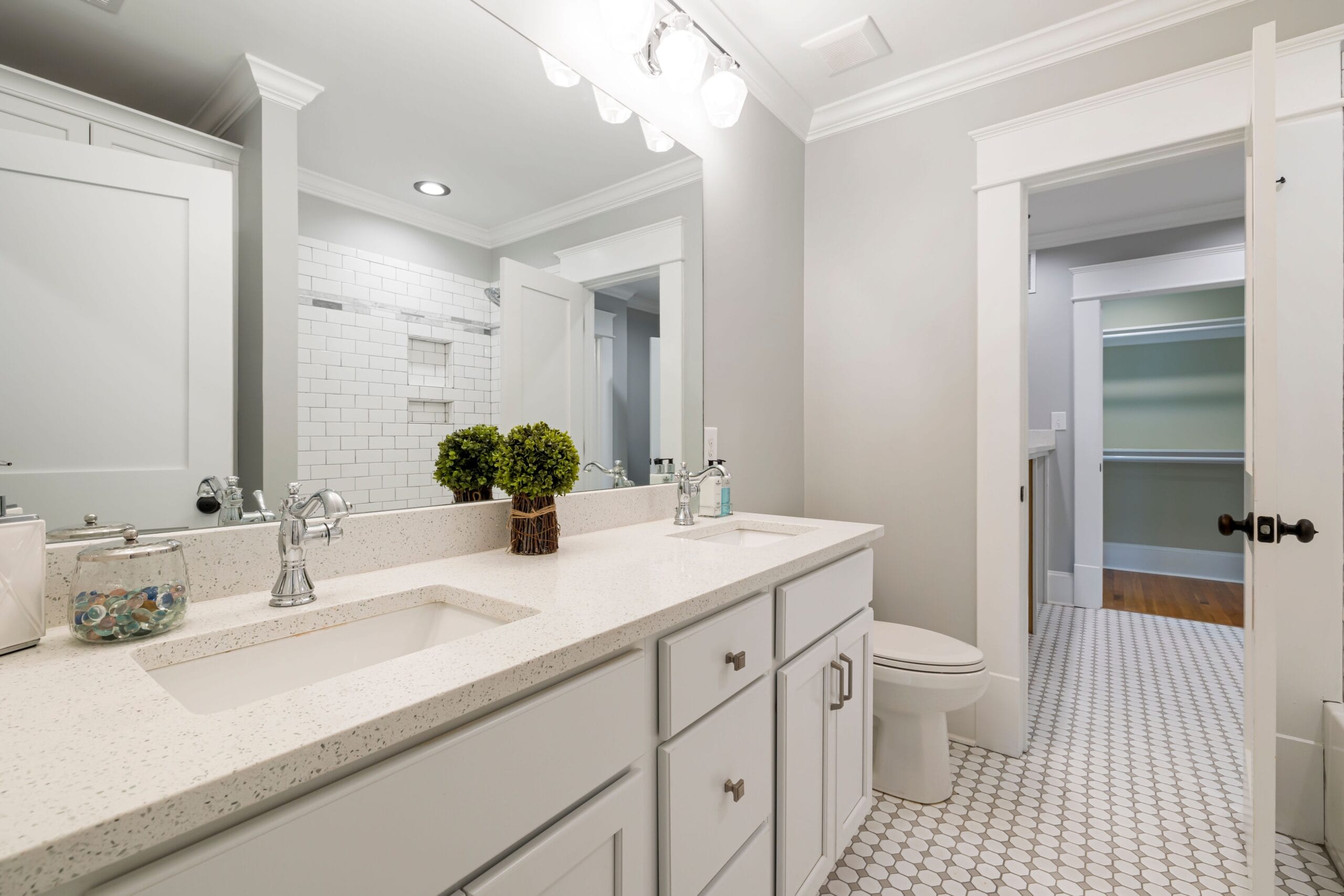 Bright and spacious modern bathroom with white fixtures and minimalist decor.